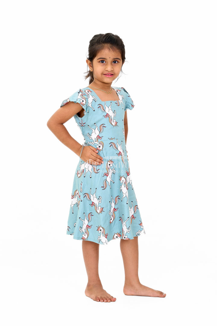 The Nesavu Girls Cotton Frock Stylish Girls Cotton Straight Dress with Unicorn Print and Ruffled Sleeves Nesavu Girls Cotton Straight Dress Unicorn Print Ruffled Sleeves Teal Finish | The Nesavu