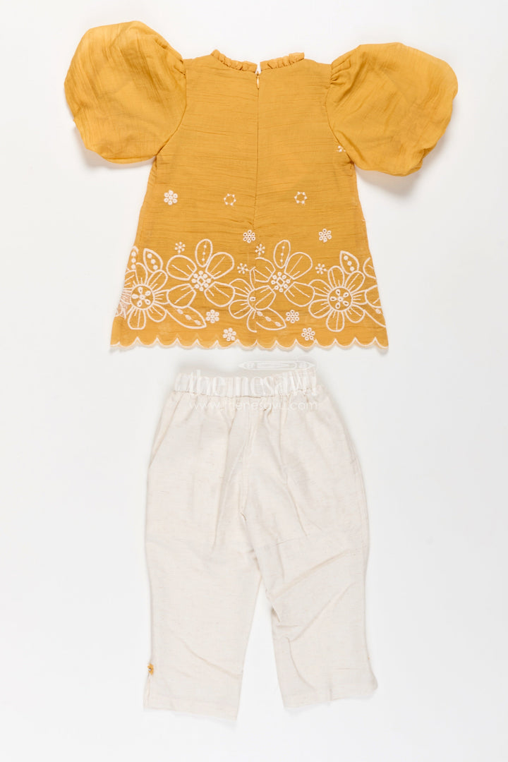 The Nesavu Girls Co-Ord Sets Suits and Co Ords for Girls in Mustard Cotton with White Pants and Floral Cutwork Embroidery Nesavu Suits Co Ords Girls Cotton Puff Sleeves White Embroidered Bottoms | The Nesavu