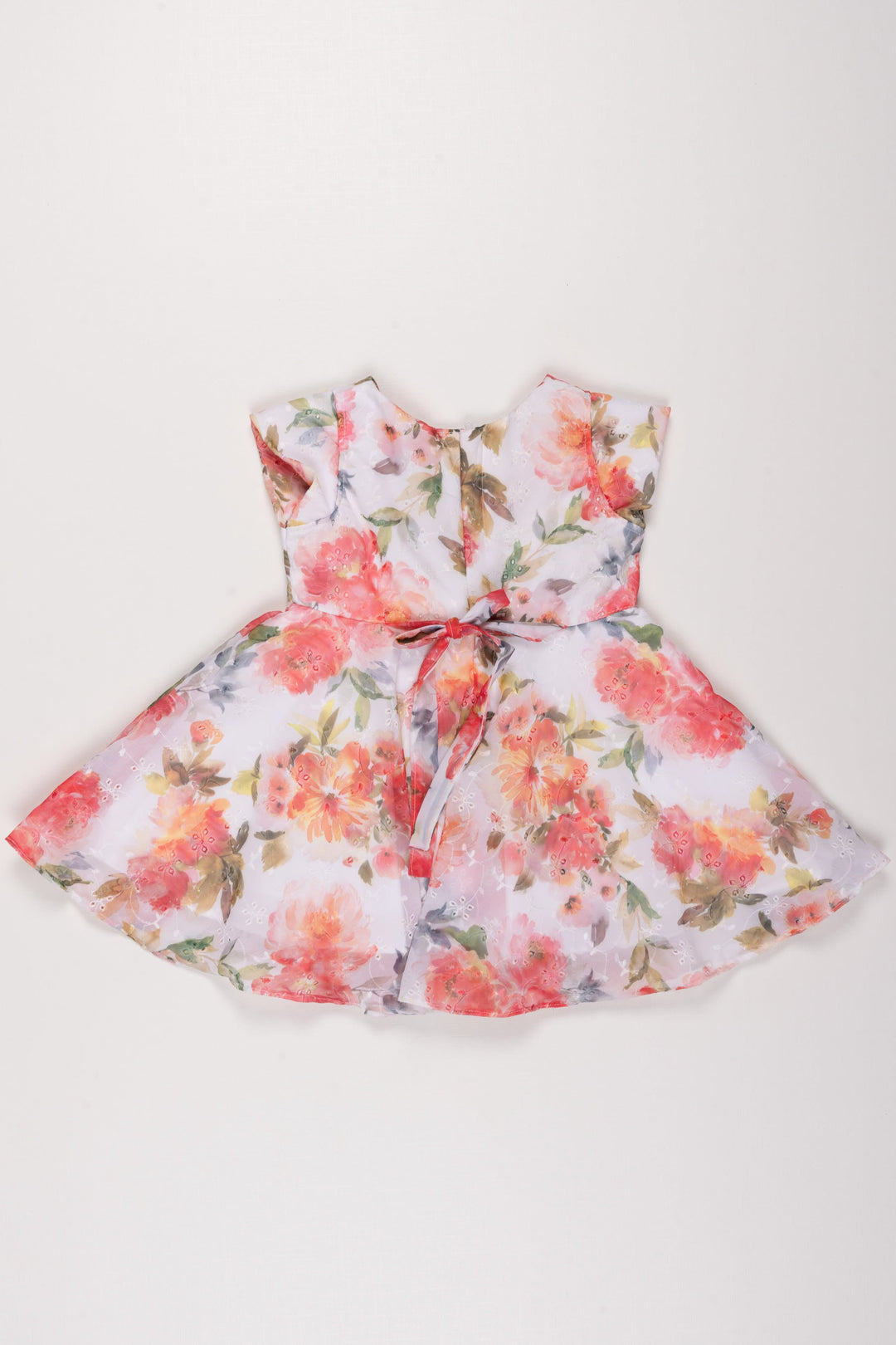 The Nesavu Girls Fancy Frock Summer Bloom Elegance Dress: Vibrant Floral Printed Frock for Girls with Bow Accent Nesavu Girls Floral Summer Dress | White Frock with Vivid Flowers | Playful Bow Detail | The Nesavu