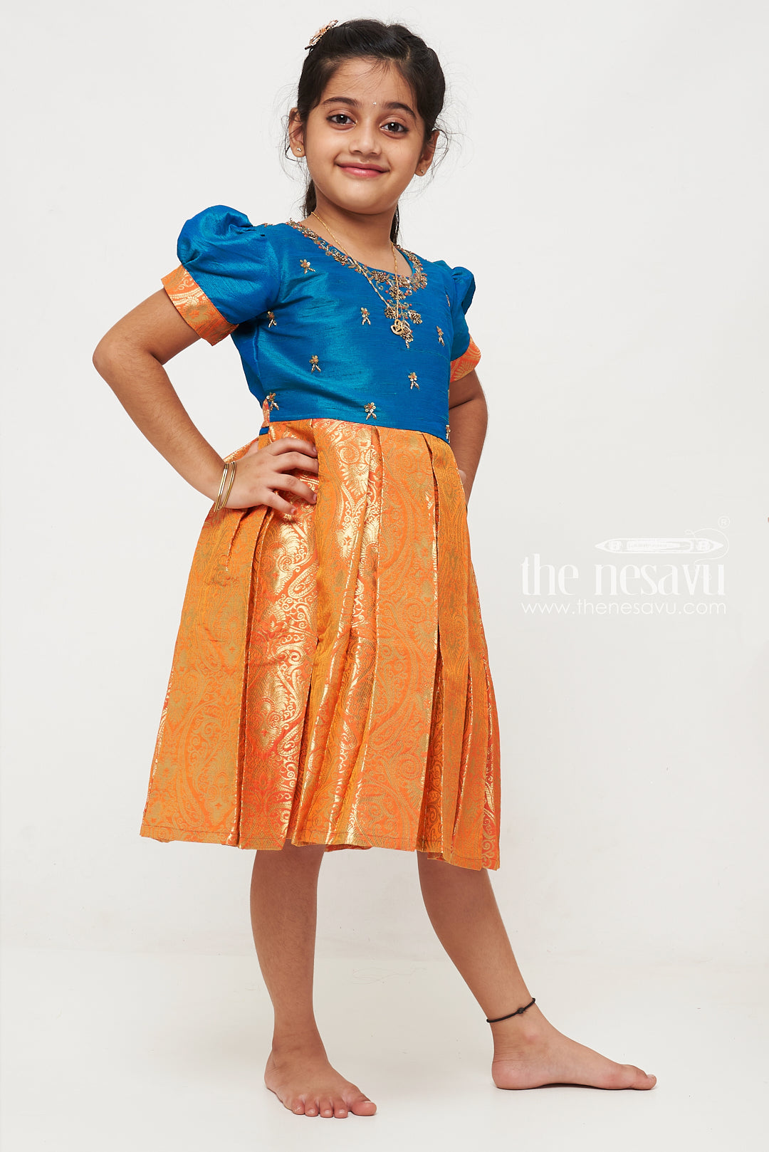 The Nesavu Silk Party Frock Teal and Orange Banarasi Semi-Silk Dress for Girls - Ideal for Festive Occasions Nesavu Teal and Orange Banarasi Semi-Silk Dress for Girls - Festive Wear