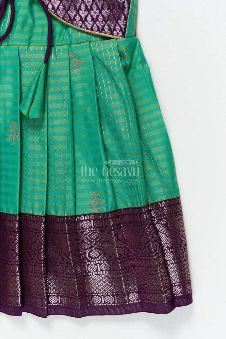 The Nesavu Girls Kanchi Silk Frock Temple Wear Silk Frock for Toddler Girls with Kanchivaram Saree Inspired Zari Border Nesavu Nesavu toddler girl temple wear silk frock with Kanchivaram style zari borders and contrast jacquard yoke