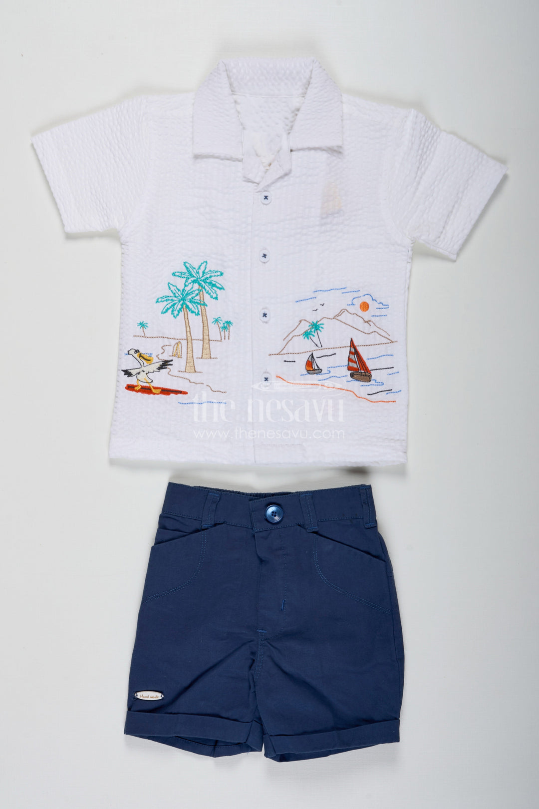 The Nesavu Boys Casual Set Thread Embroidery Boys Casual Shirt Set with Beach Scene Motif and Navy Blue Shorts in Crush Cotton Blend Nesavu 16 (1Y) / Blue BCS229B-16 Thread Embroidery Boys Shirt Set with Beach Motif in Crush Cotton and Navy Blue Shorts | The Nesavu