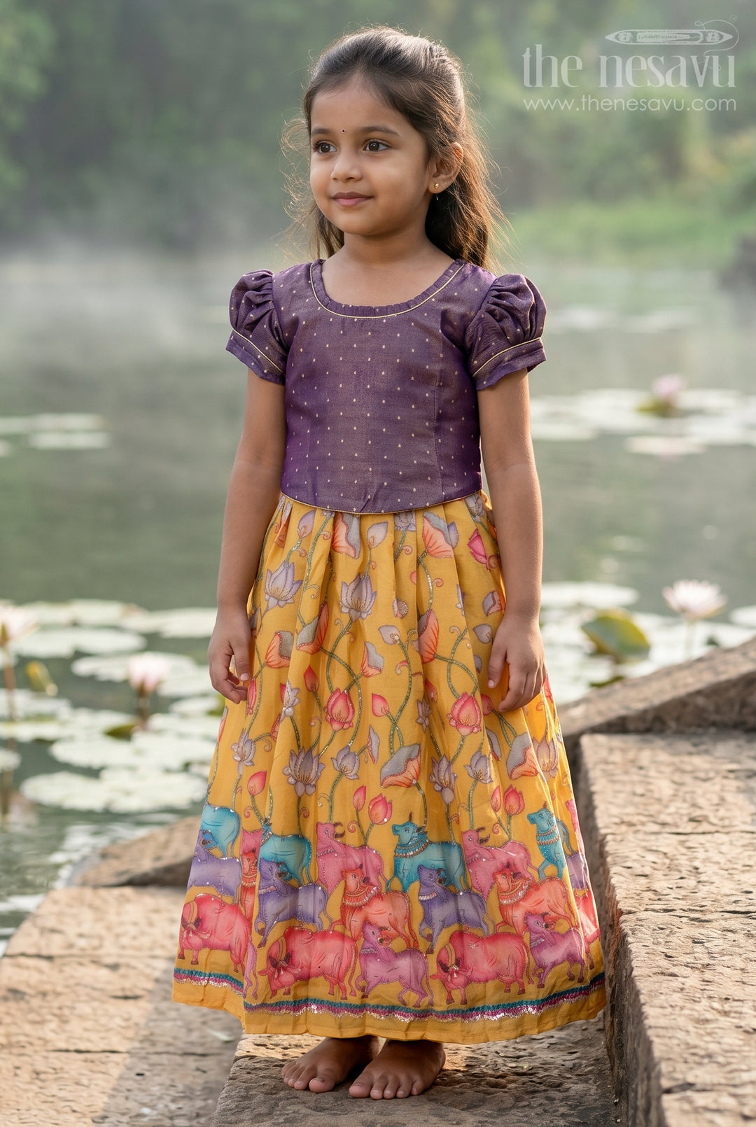 The Nesavu Pattu Pavadai Toddler Girl Pattu Pavadai for Festive Events and Birthdays Nesavu 18 (2Y) / Purple / Semi Banarasi GPP395A-18 Nesavu Toddler Girl Pattu Pavadai With Artistic Printed Skirt And Sequence Embroidered Blouse