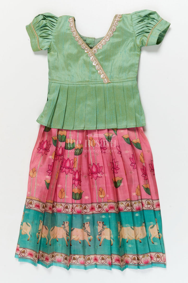 The Nesavu Pattu Pavadai Traditional Baby Pattu Pavadai with Cow and Lotus Print for Ethnic Functions Nesavu Nesavu baby girl pattu pavadai with cow border and lotus skirt for traditional pooja wear