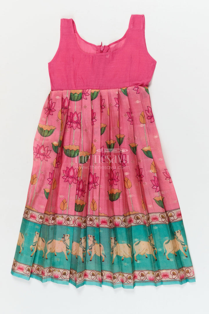 The Nesavu Pattu Pavadai Traditional Baby Pattu Pavadai with Cow and Lotus Print for Ethnic Functions Nesavu Nesavu baby girl pattu pavadai with cow border and lotus skirt for traditional pooja wear