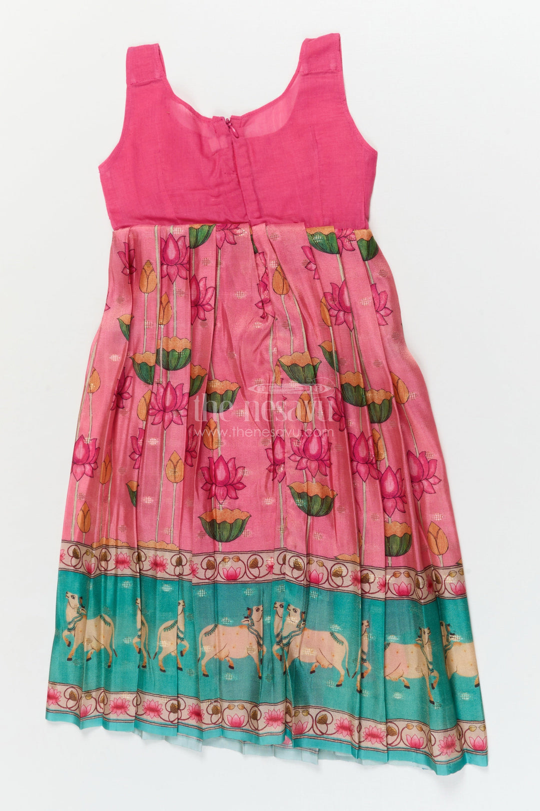 The Nesavu Pattu Pavadai Traditional Baby Pattu Pavadai with Cow and Lotus Print for Ethnic Functions Nesavu Nesavu baby girl pattu pavadai with cow border and lotus skirt for traditional pooja wear