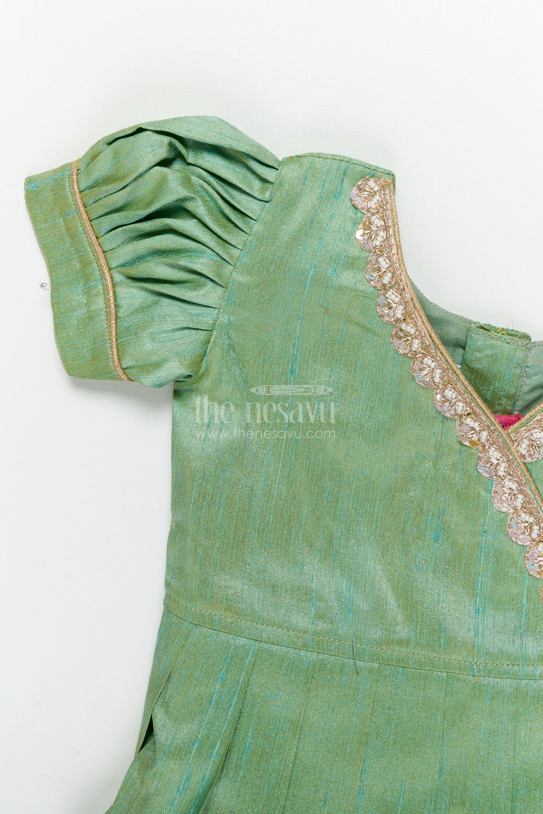 The Nesavu Pattu Pavadai Traditional Baby Pattu Pavadai with Cow and Lotus Print for Ethnic Functions Nesavu Nesavu baby girl pattu pavadai with cow border and lotus skirt for traditional pooja wear