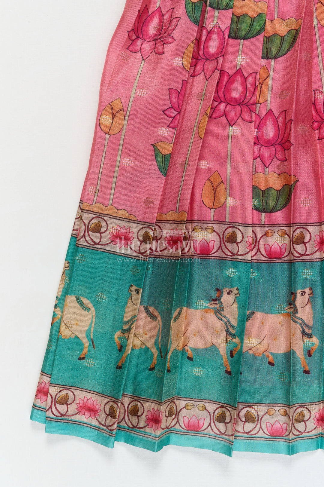 The Nesavu Pattu Pavadai Traditional Baby Pattu Pavadai with Cow and Lotus Print for Ethnic Functions Nesavu Nesavu baby girl pattu pavadai with cow border and lotus skirt for traditional pooja wear