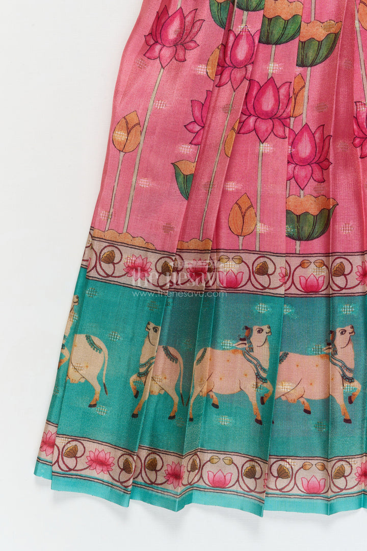 The Nesavu Pattu Pavadai Traditional Baby Pattu Pavadai with Cow and Lotus Print for Ethnic Functions Nesavu Nesavu baby girl pattu pavadai with cow border and lotus skirt for traditional pooja wear