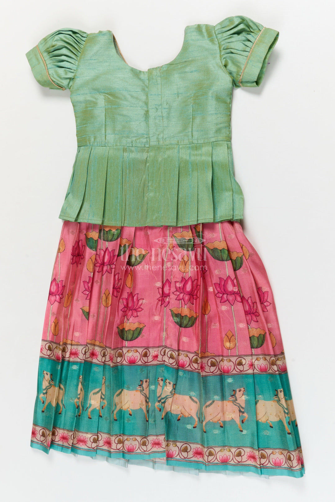The Nesavu Pattu Pavadai Traditional Baby Pattu Pavadai with Cow and Lotus Print for Ethnic Functions Nesavu Nesavu baby girl pattu pavadai with cow border and lotus skirt for traditional pooja wear