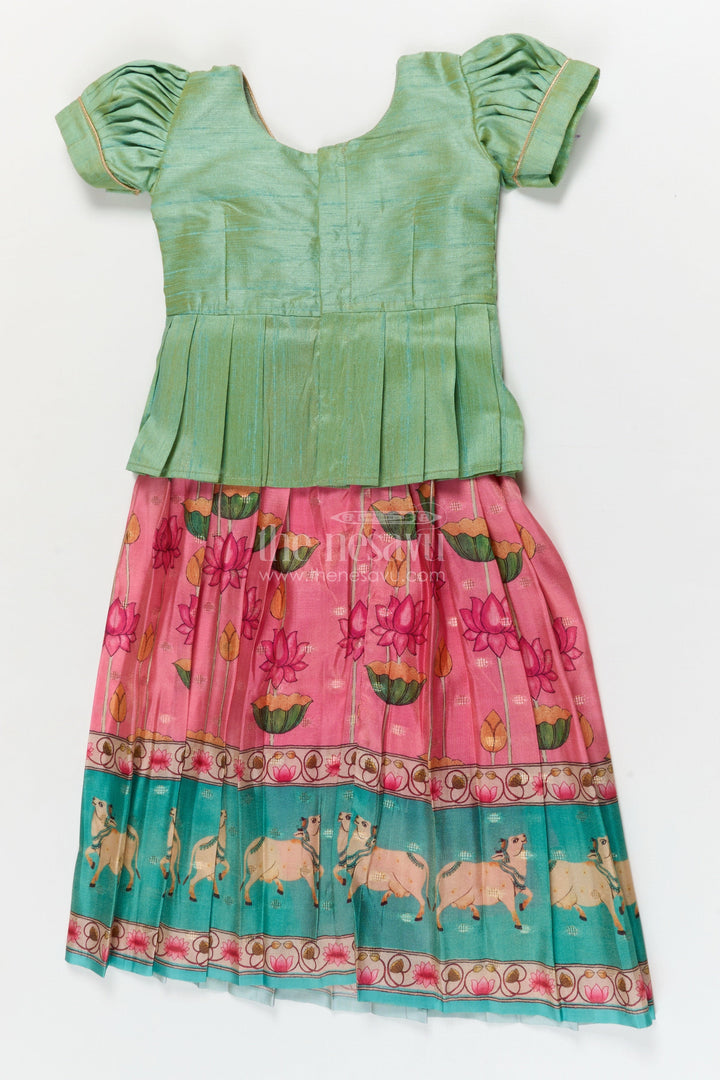 The Nesavu Pattu Pavadai Traditional Baby Pattu Pavadai with Cow and Lotus Print for Ethnic Functions Nesavu Nesavu baby girl pattu pavadai with cow border and lotus skirt for traditional pooja wear