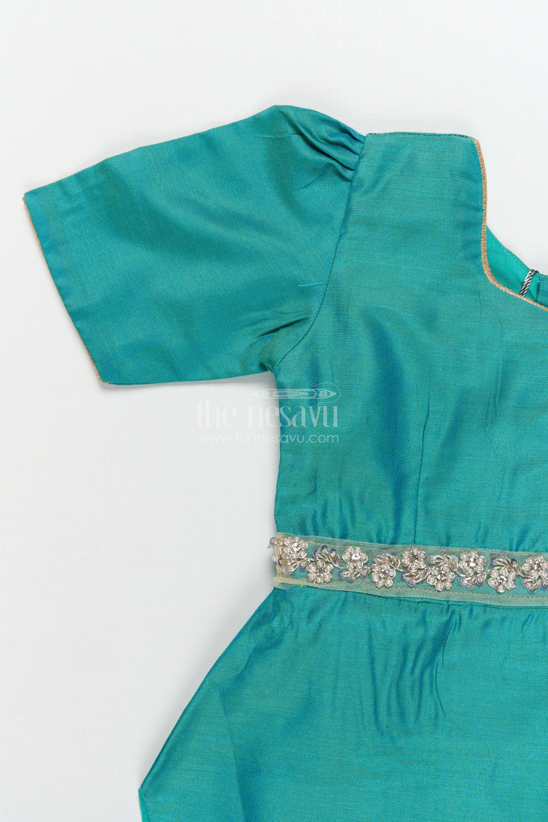 The Nesavu Pattu Pavadai Traditional Baby Pattu Pavadai with Lotus Print Skirt for Festive Photoshoots Nesavu Nesavu baby pattu pavadai with lotus print skirt and scallop blouse for festive occasions
