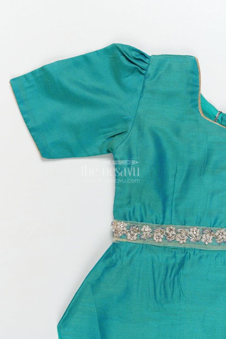The Nesavu Pattu Pavadai Traditional Baby Pattu Pavadai with Lotus Print Skirt for Festive Photoshoots Nesavu Nesavu baby pattu pavadai with lotus print skirt and scallop blouse for festive occasions