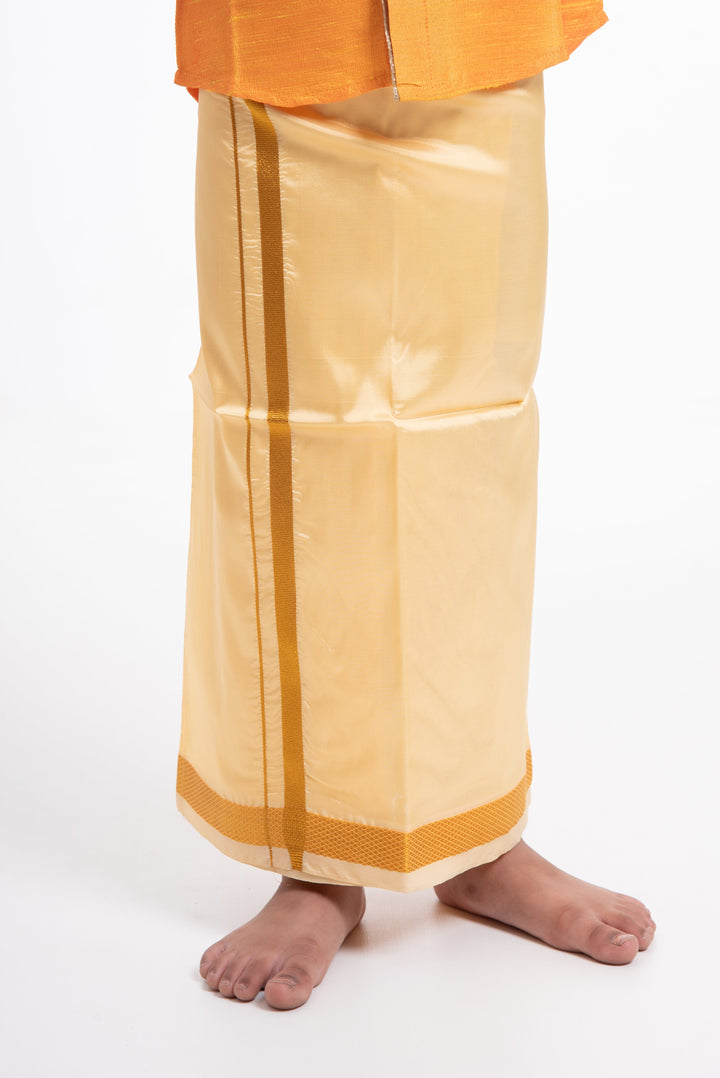 The Nesavu Boys Vesti Traditional Golden Silk Dhoti for Boys with Elegant Border Detailing Nesavu Elegant Golden Silk Dhoti for Boys | The Nesavu