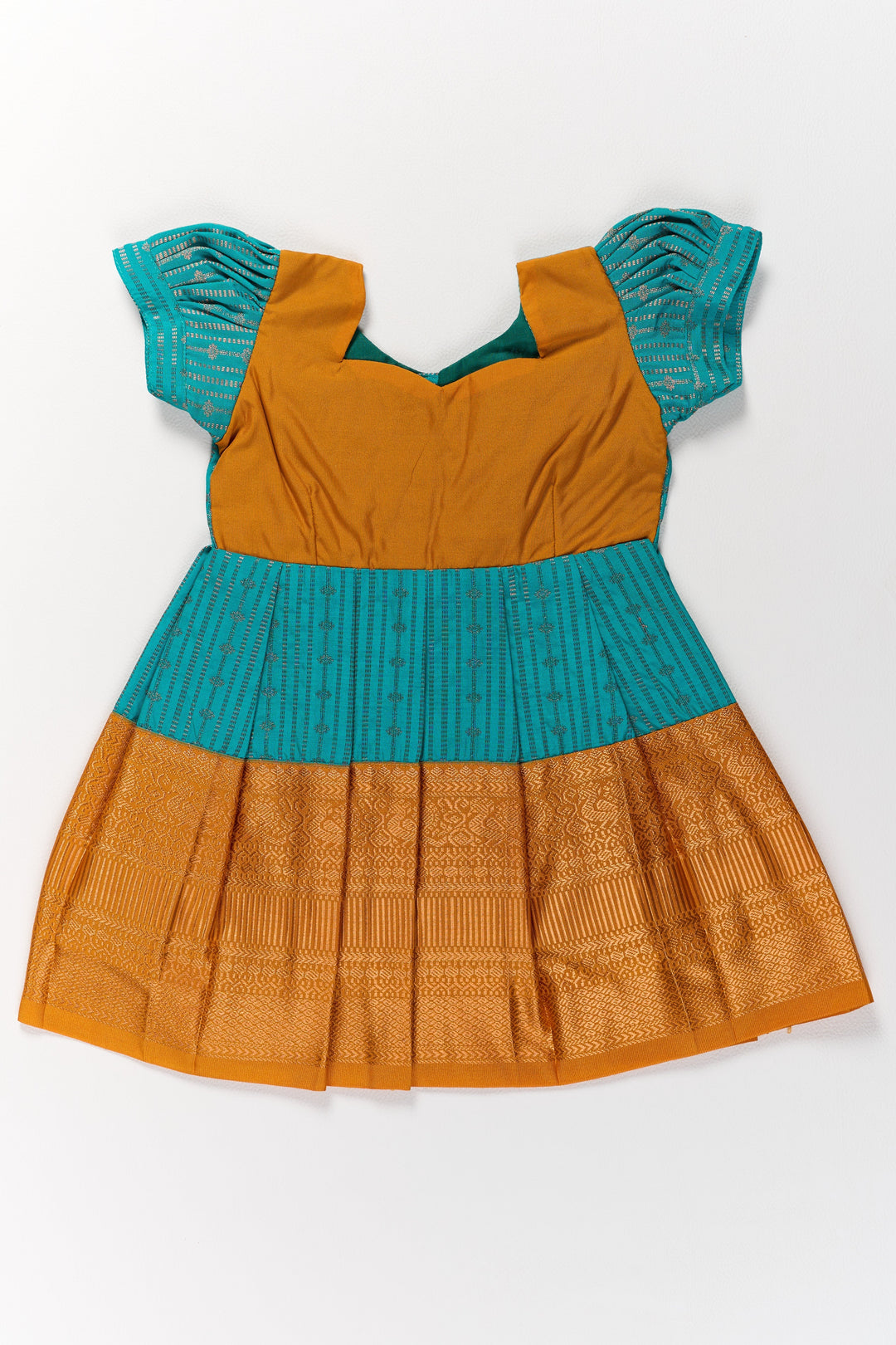 The Nesavu Girls Kanchi Silk Frock Traditional Green and Gold Pattu Pavadai for Girls with Intricate Zari Borders Nesavu Traditional Green Gold Pattu Pavadai Girls Zari Borders | The Nesavu