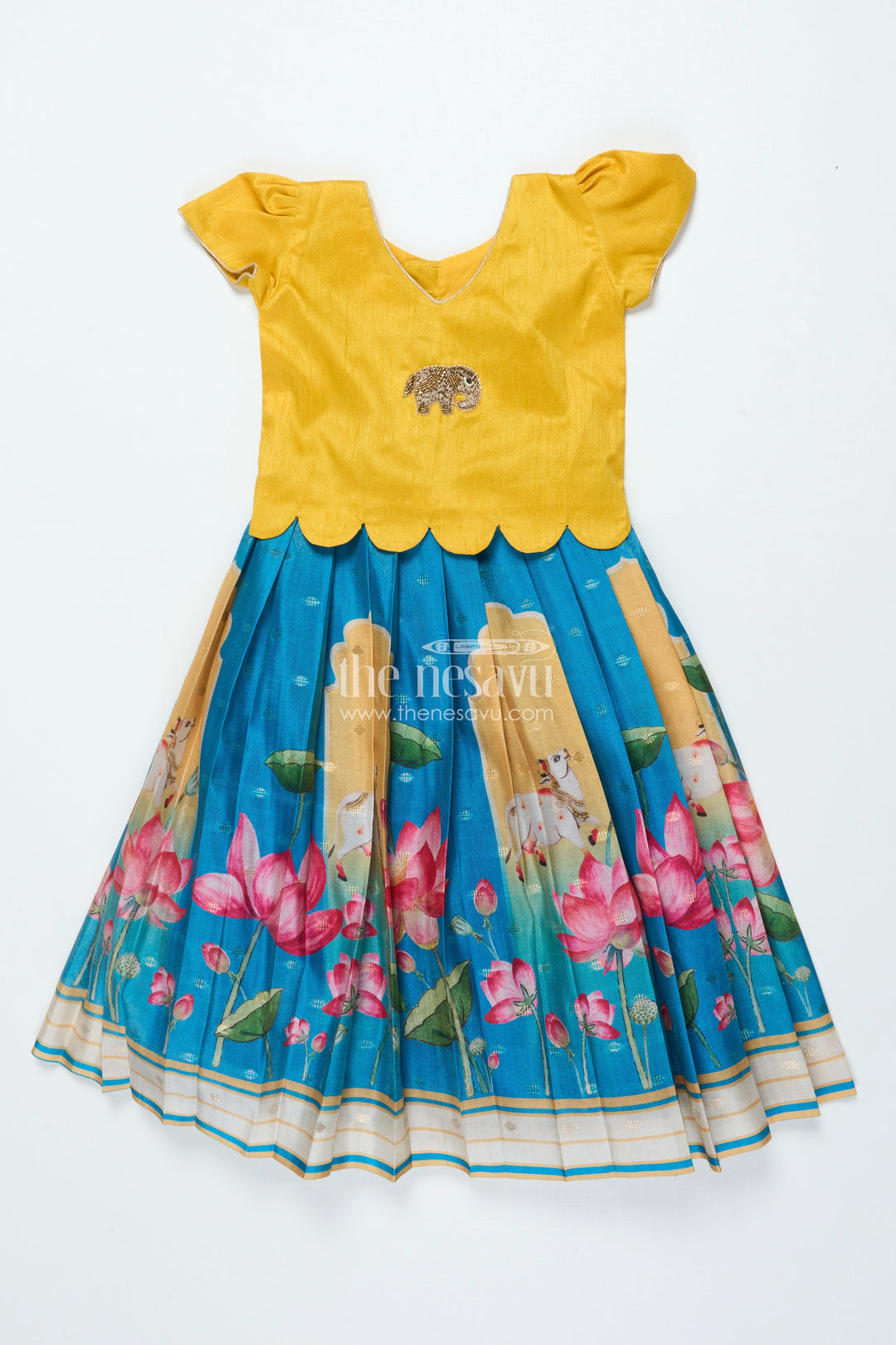 The Nesavu Pattu Pavadai Traditional Pattu Pavadai for Baby Girls for Temple and Cultural Events Nesavu Nesavu baby girl pattu pavadai Krishna print skirt scalloped sleeve blouse festive wear