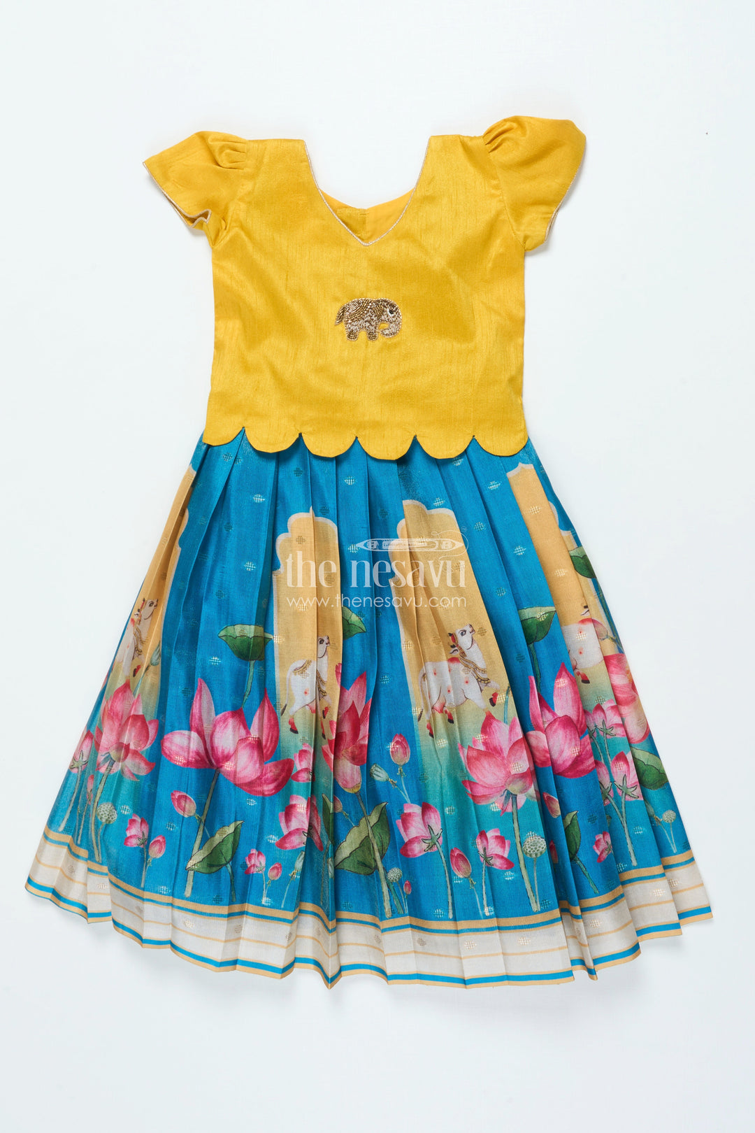 The Nesavu Pattu Pavadai Traditional Pattu Pavadai for Baby Girls for Temple and Cultural Events Nesavu Nesavu baby girl pattu pavadai Krishna print skirt scalloped sleeve blouse festive wear