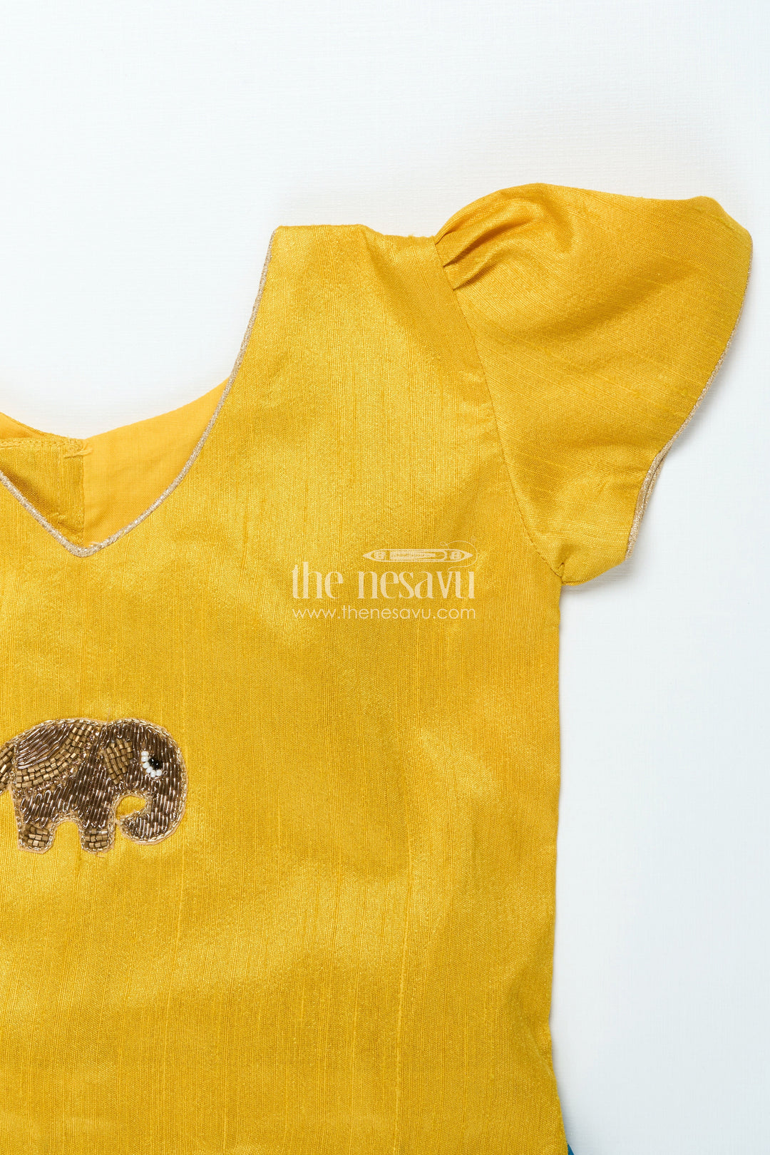 The Nesavu Pattu Pavadai Traditional Pattu Pavadai for Baby Girls for Temple and Cultural Events Nesavu Nesavu baby girl pattu pavadai Krishna print skirt scalloped sleeve blouse festive wear