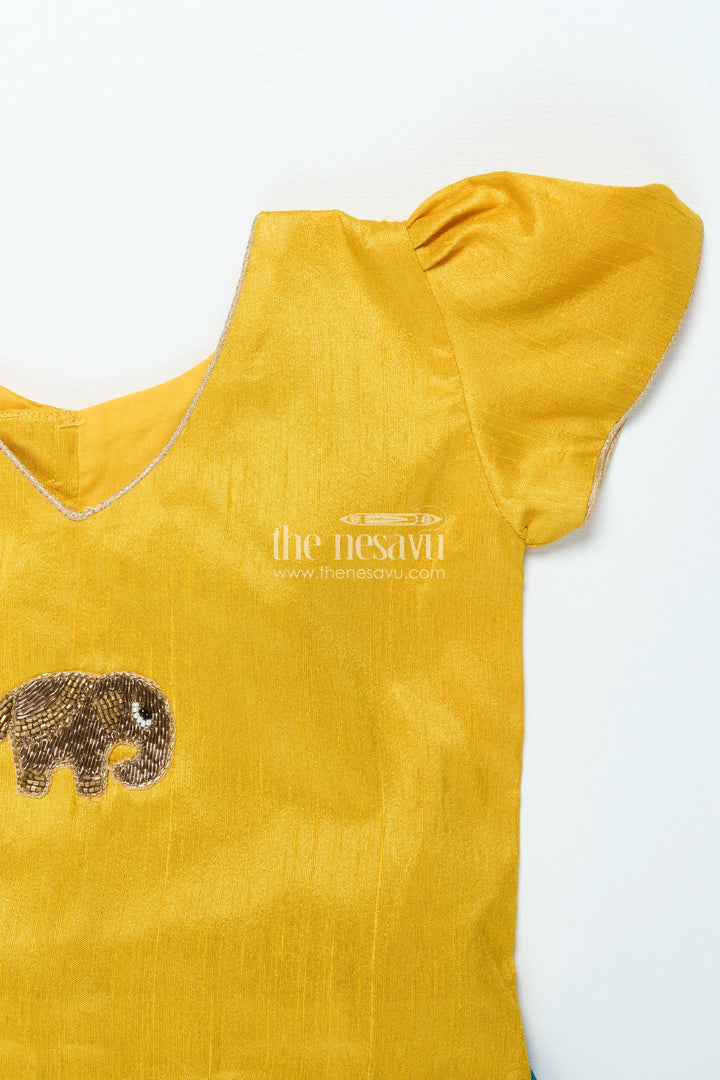 The Nesavu Pattu Pavadai Traditional Pattu Pavadai for Baby Girls for Temple and Cultural Events Nesavu Nesavu baby girl pattu pavadai Krishna print skirt scalloped sleeve blouse festive wear