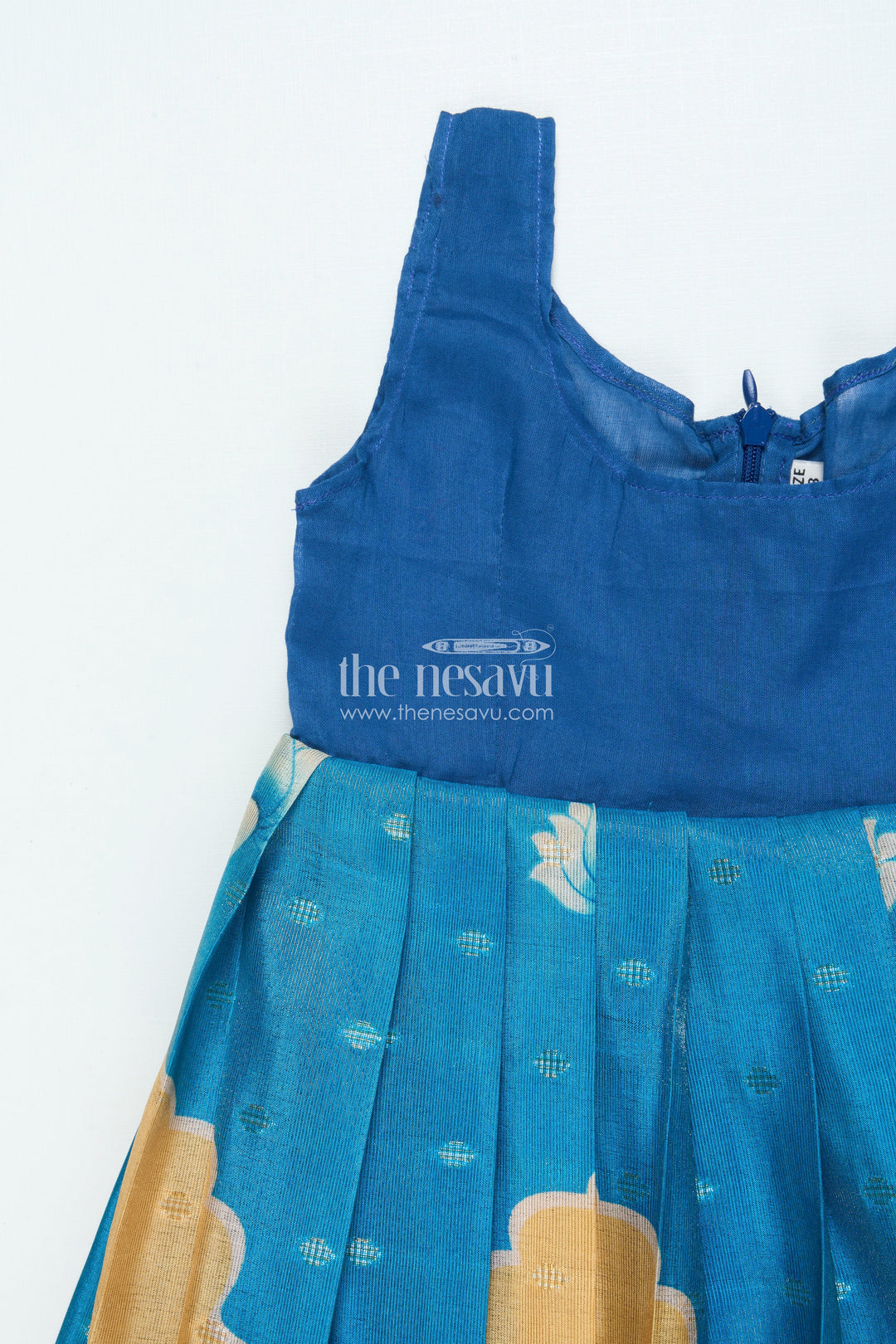 The Nesavu Pattu Pavadai Traditional Pattu Pavadai for Baby Girls for Temple and Cultural Events Nesavu Nesavu baby girl pattu pavadai Krishna print skirt scalloped sleeve blouse festive wear