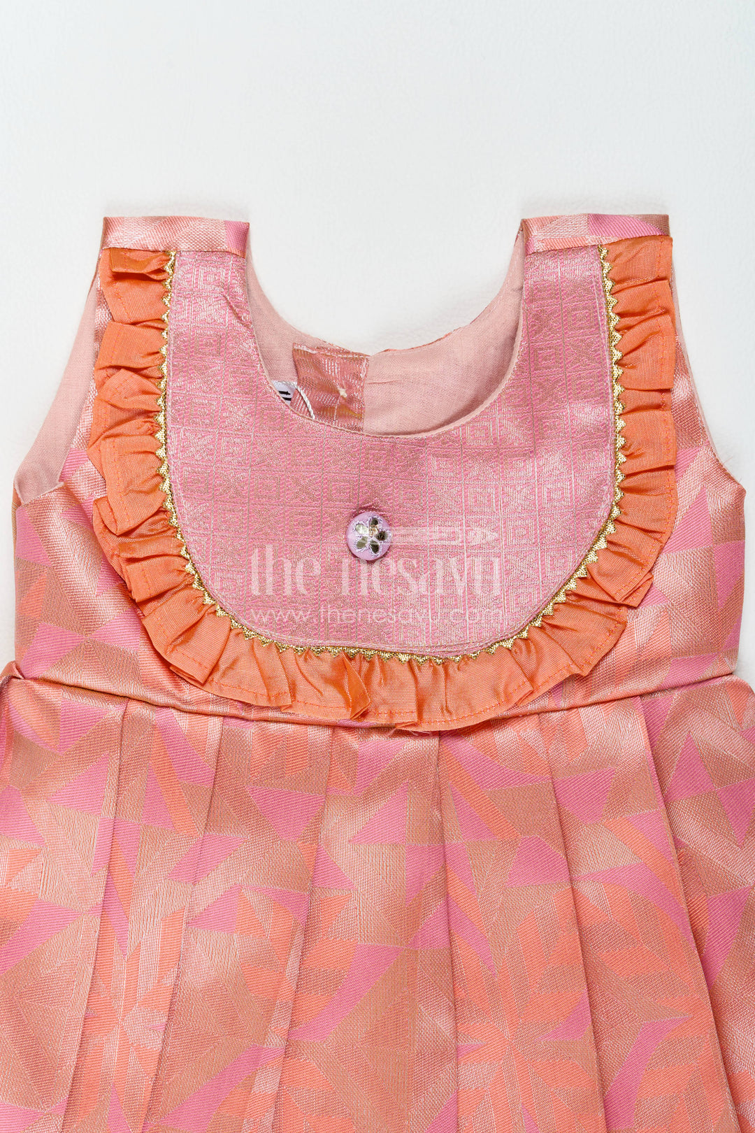 The Nesavu Girls Kanchi Silk Frock Traditional Silk Frock in Peach for Festive Gatherings Nesavu Nesavu Traditional Silk Frock In Peach For Festive Gatherings