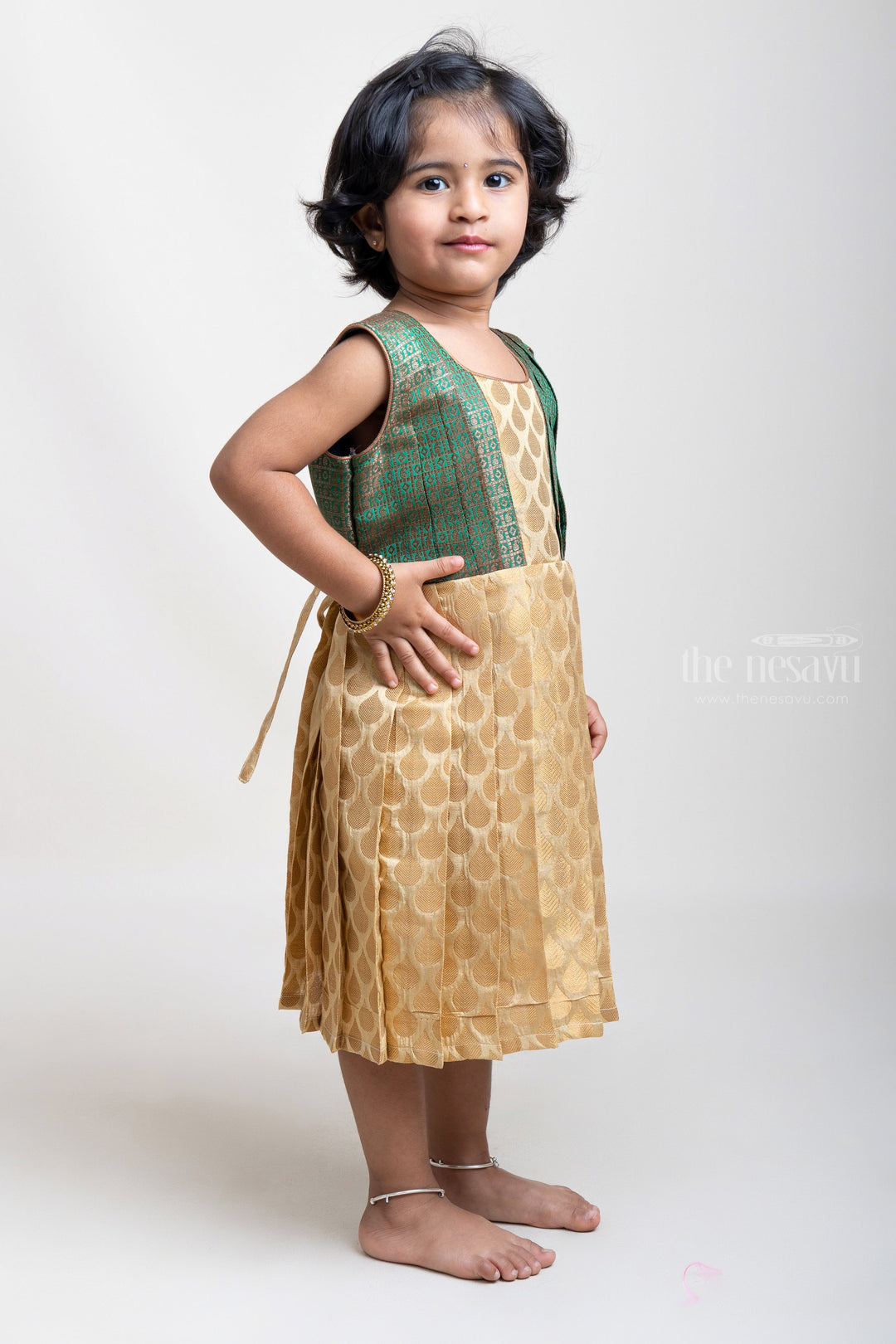 The Nesavu Silk Frock Trendy Beige Pleated Semi-Silk with Green Designer Yoke Frock For Girls Nesavu Versatile Silk Frocks for Every Season | Premium Silk Frocks | The Nesavu