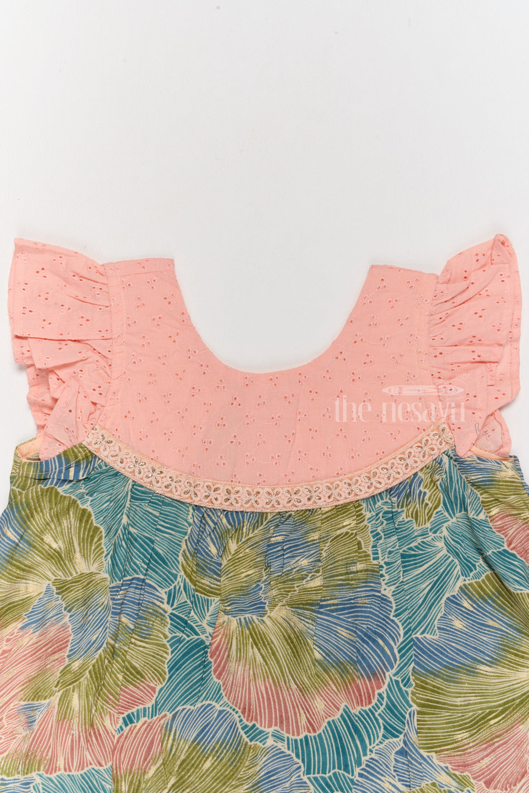 The Nesavu Girls Cotton Frock Trendy Girls Cotton New Dress with Vibrant Leaf Print and Lace Yoke Nesavu Girls Cotton New Dress Bold Leaf Print Flutter Sleeves Lace Detailing | The Nesavu