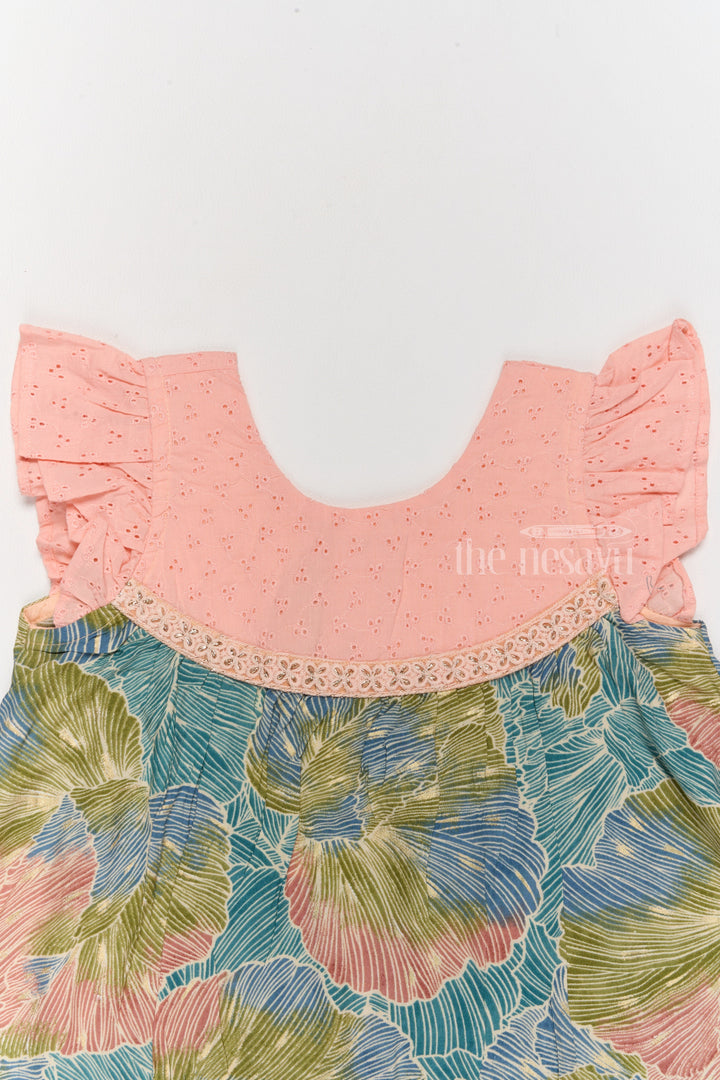 The Nesavu Girls Cotton Frock Trendy Girls Cotton New Dress with Vibrant Leaf Print and Lace Yoke Nesavu Girls Cotton New Dress Bold Leaf Print Flutter Sleeves Lace Detailing | The Nesavu