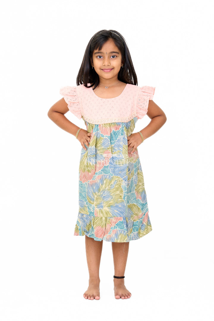The Nesavu Girls Cotton Frock Trendy Girls Cotton New Dress with Vibrant Leaf Print and Lace Yoke Nesavu Girls Cotton New Dress Bold Leaf Print Flutter Sleeves Lace Detailing | The Nesavu