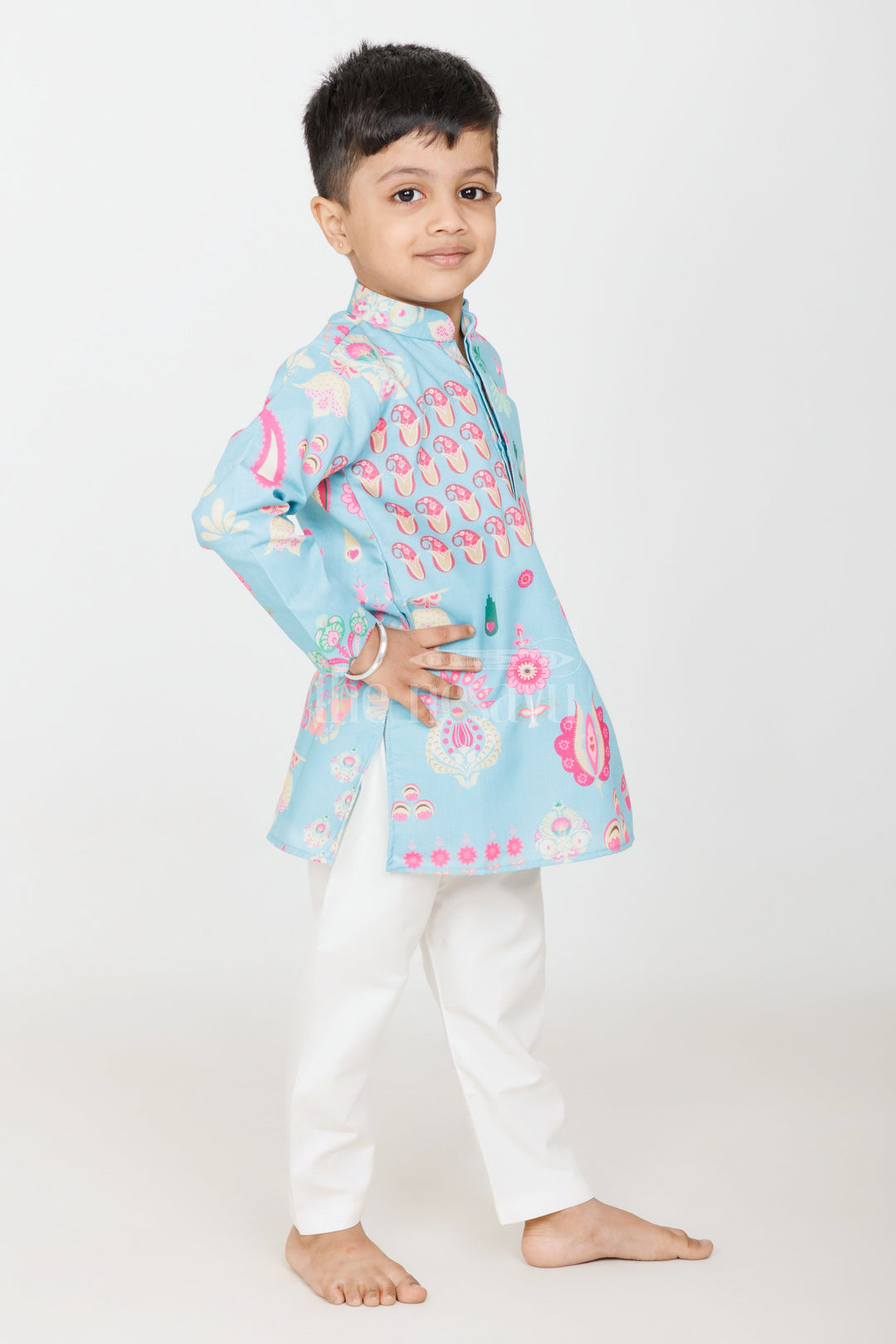 The Nesavu Boys Kurtha Set Turquoise Blended Silk Kurta Set for Boys with Floral and Paisley Prints for Traditional Events Nesavu Nesavu Boys Turquoise Silk Kurta Set Floral Paisley Prints Traditional Festive Wear