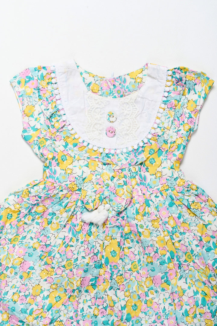 The Nesavu Girls Cotton Frock Vibrant Girls Cotton Frock with Multicolor Floral Print and Lace Hem – Frock for Reception Nesavu Nesavu Girls Cotton Frock Multicolor Floral Print Lace Trim  Ideal Frock Reception
