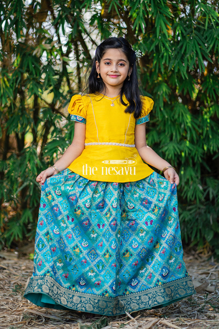 The Nesavu Pattu Pavadai Vibrant Yellow and Teal Girls Pattu Pavadai Handcrafted Silk Skirt Blouse Set Nesavu Vibrant Yellow and Teal Girls Pattu Pavadai | The Nesavu