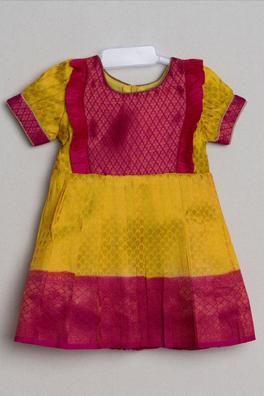 The Nesavu Girls Kanchi Silk Frock Vibrant Yellow Pink Banarasi Soft Silk / Pattu Frocks For Toddler Girl With Ruffle Yoke Nesavu 18 (2Y) / Yellow / Medium Border SF610B-18 Traditional Silk Wear Frock | Latest Kanchi Silk Dress | The Nesavu