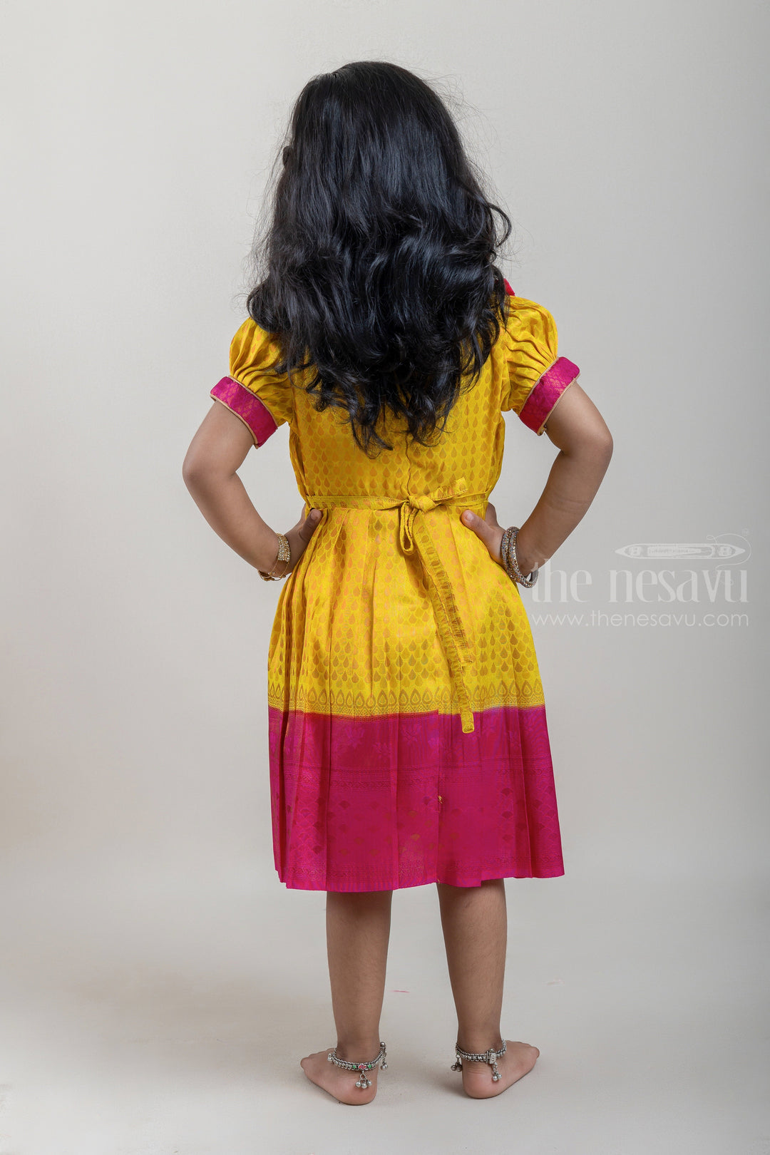 The Nesavu Girls Kanchi Silk Frock Vibrant Yellow Pink Banarasi Soft Silk / Pattu Frocks For Toddler Girl With Ruffle Yoke Nesavu Traditional Silk Wear Frock | Latest Kanchi Silk Dress | The Nesavu