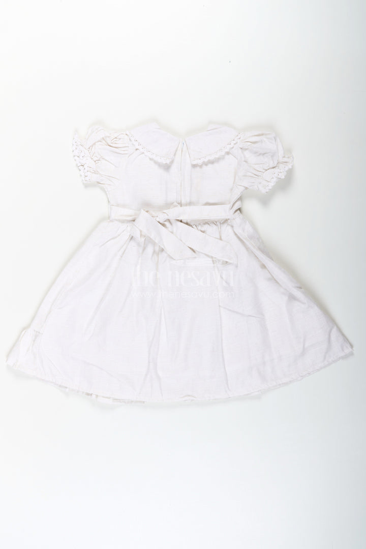The Nesavu Girls Cotton Frock White Cotton Frocks for Girls with Floral Embroidery Puff Sleeves and Peter Pan Collar Nesavu White Cotton Frocks for Girls with Embroidery Puff Sleeves and Peter Pan Lace Collar | The Nesavu