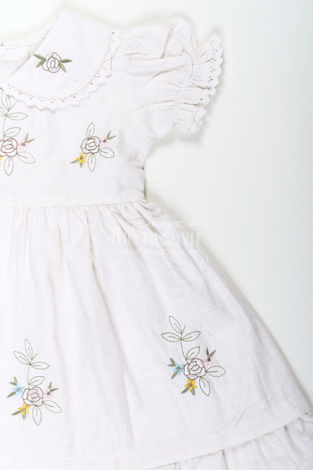 The Nesavu Girls Cotton Frock White Cotton Frocks for Girls with Floral Embroidery Puff Sleeves and Peter Pan Collar Nesavu White Cotton Frocks for Girls with Embroidery Puff Sleeves and Peter Pan Lace Collar | The Nesavu