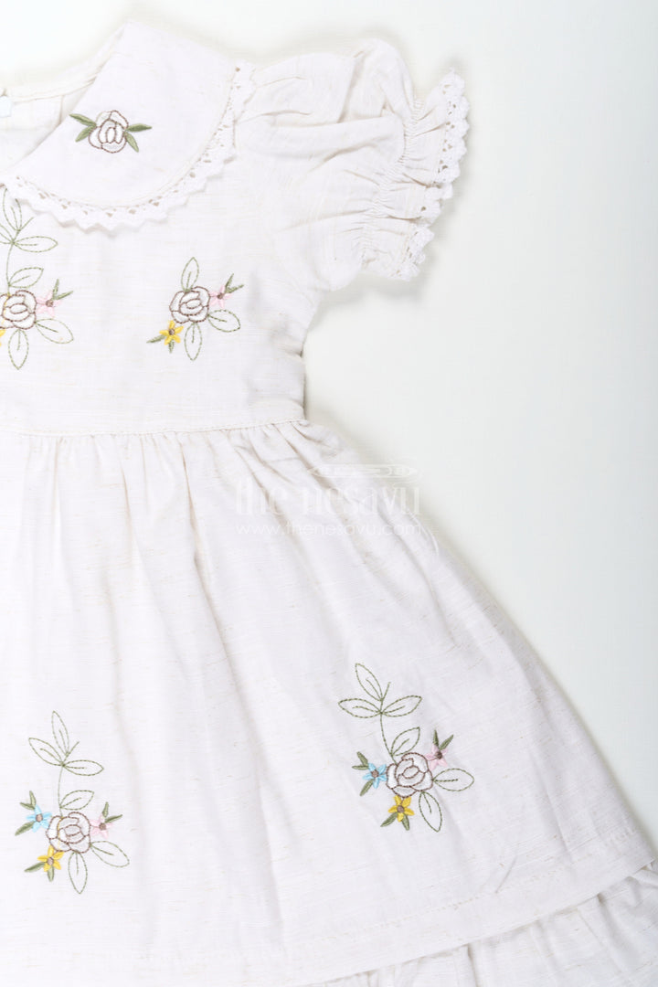 The Nesavu Girls Cotton Frock White Cotton Frocks for Girls with Floral Embroidery Puff Sleeves and Peter Pan Collar Nesavu White Cotton Frocks for Girls with Embroidery Puff Sleeves and Peter Pan Lace Collar | The Nesavu