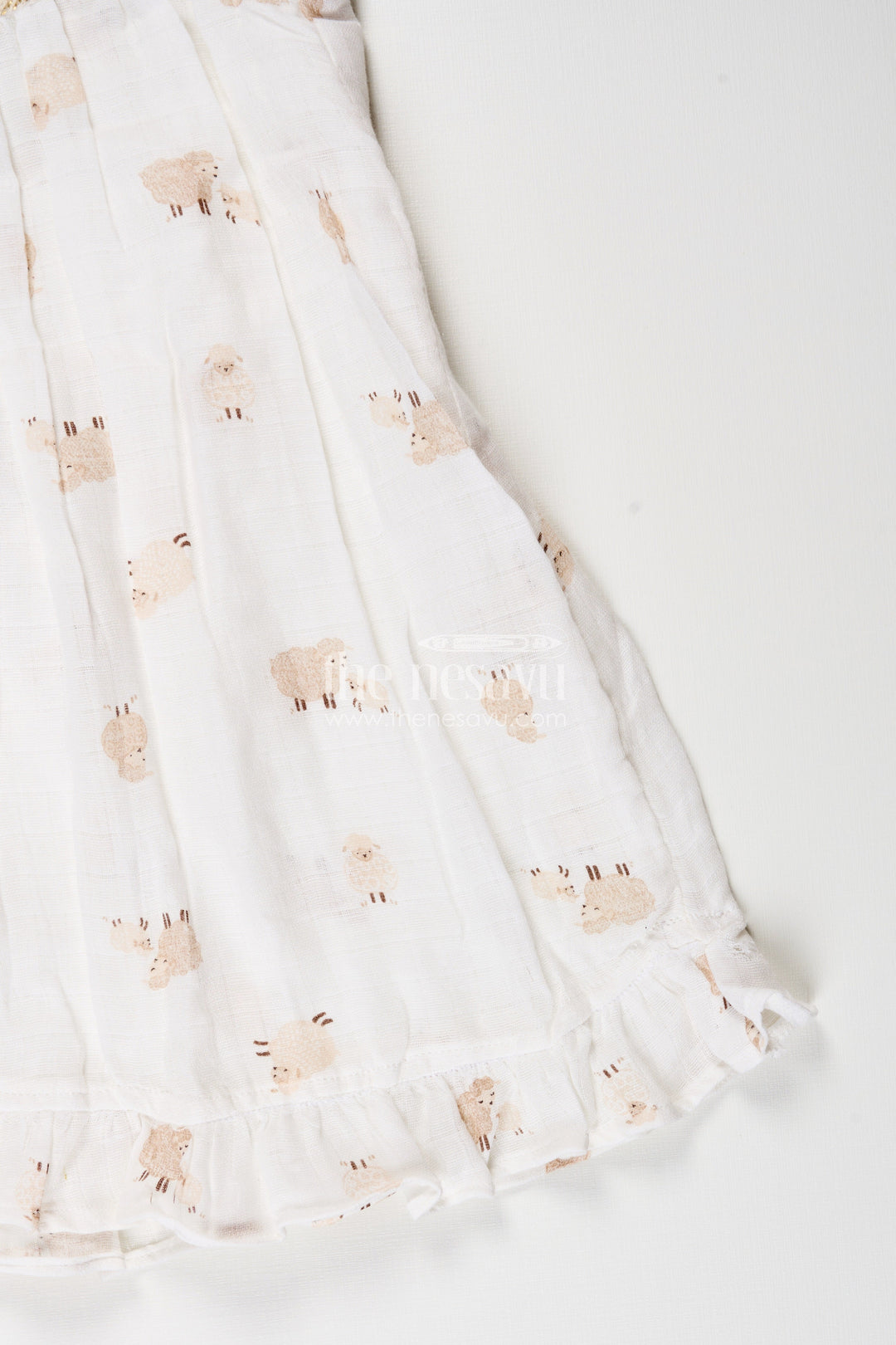 The Nesavu Girls Cotton Frock White Muslin Cotton Frock for Baby Girls with Soft Sheep Print Nesavu Nesavu baby girls white muslin cotton frock with sheep print and ruffle detailing for everyday wear
