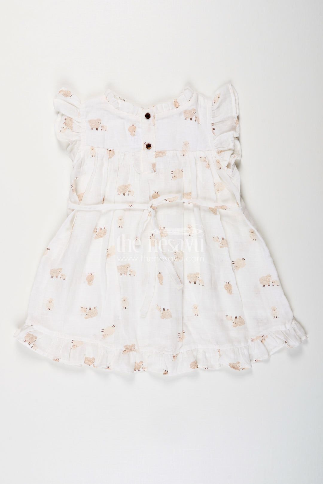 The Nesavu Girls Cotton Frock White Muslin Cotton Frock for Baby Girls with Soft Sheep Print Nesavu Nesavu baby girls white muslin cotton frock with sheep print and ruffle detailing for everyday wear
