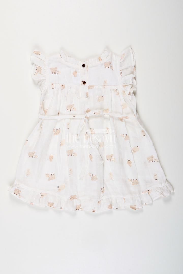 The Nesavu Girls Cotton Frock White Muslin Cotton Frock for Baby Girls with Soft Sheep Print Nesavu Nesavu baby girls white muslin cotton frock with sheep print and ruffle detailing for everyday wear