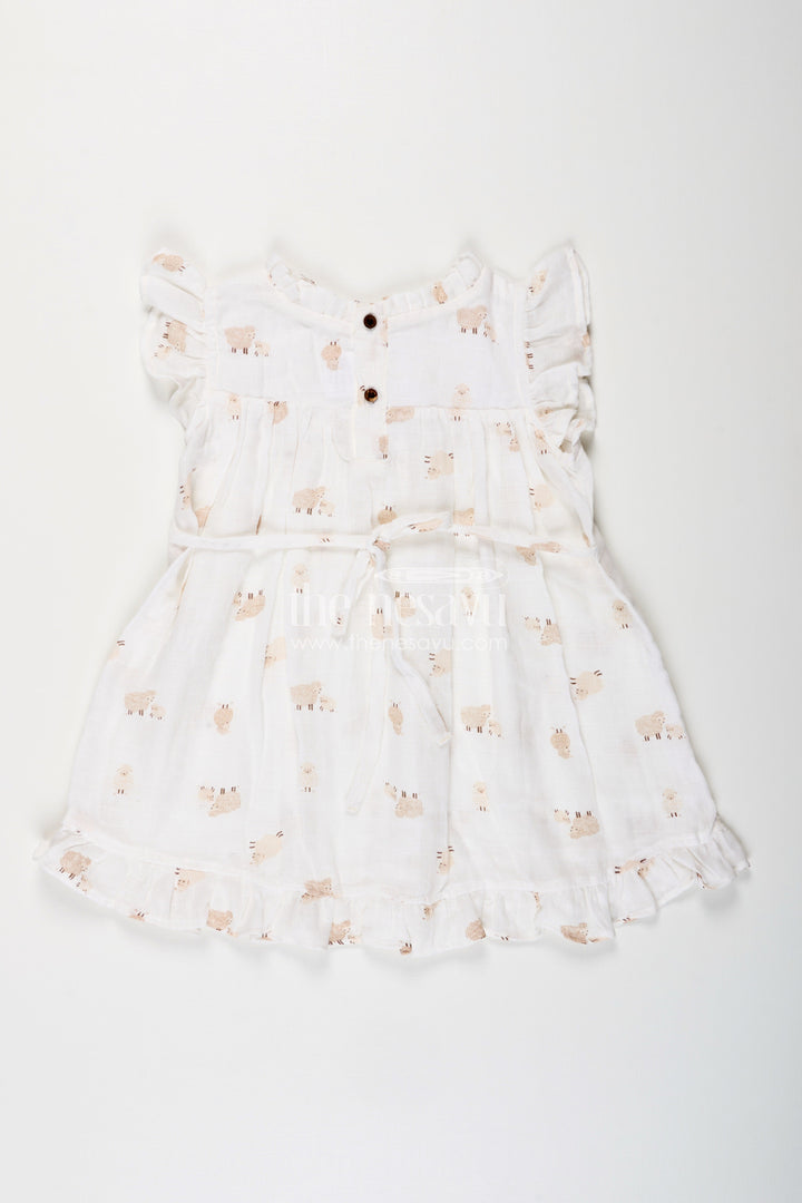 The Nesavu Girls Cotton Frock White Muslin Cotton Frock for Baby Girls with Soft Sheep Print Nesavu Nesavu baby girls white muslin cotton frock with sheep print and ruffle detailing for everyday wear