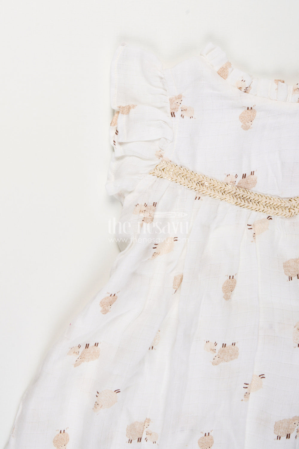 The Nesavu Girls Cotton Frock White Muslin Cotton Frock for Baby Girls with Soft Sheep Print Nesavu Nesavu baby girls white muslin cotton frock with sheep print and ruffle detailing for everyday wear