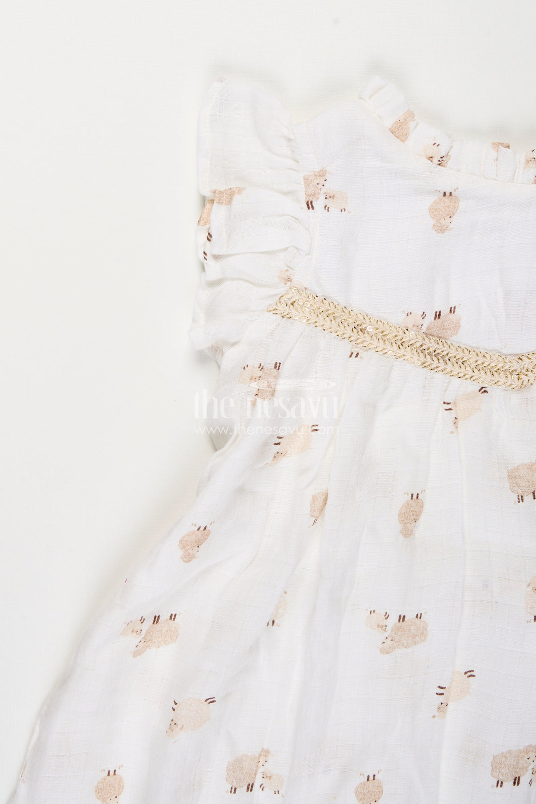 The Nesavu Girls Cotton Frock White Muslin Cotton Frock for Baby Girls with Soft Sheep Print Nesavu Nesavu baby girls white muslin cotton frock with sheep print and ruffle detailing for everyday wear