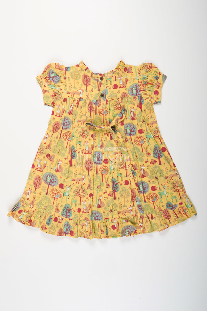 The Nesavu Girls Cotton Frock Woodland Animal Print Cotton Frock for Toddler Girls Nesavu Nesavu yellow cotton frock for toddler girls with woodland animal print and frill detailing