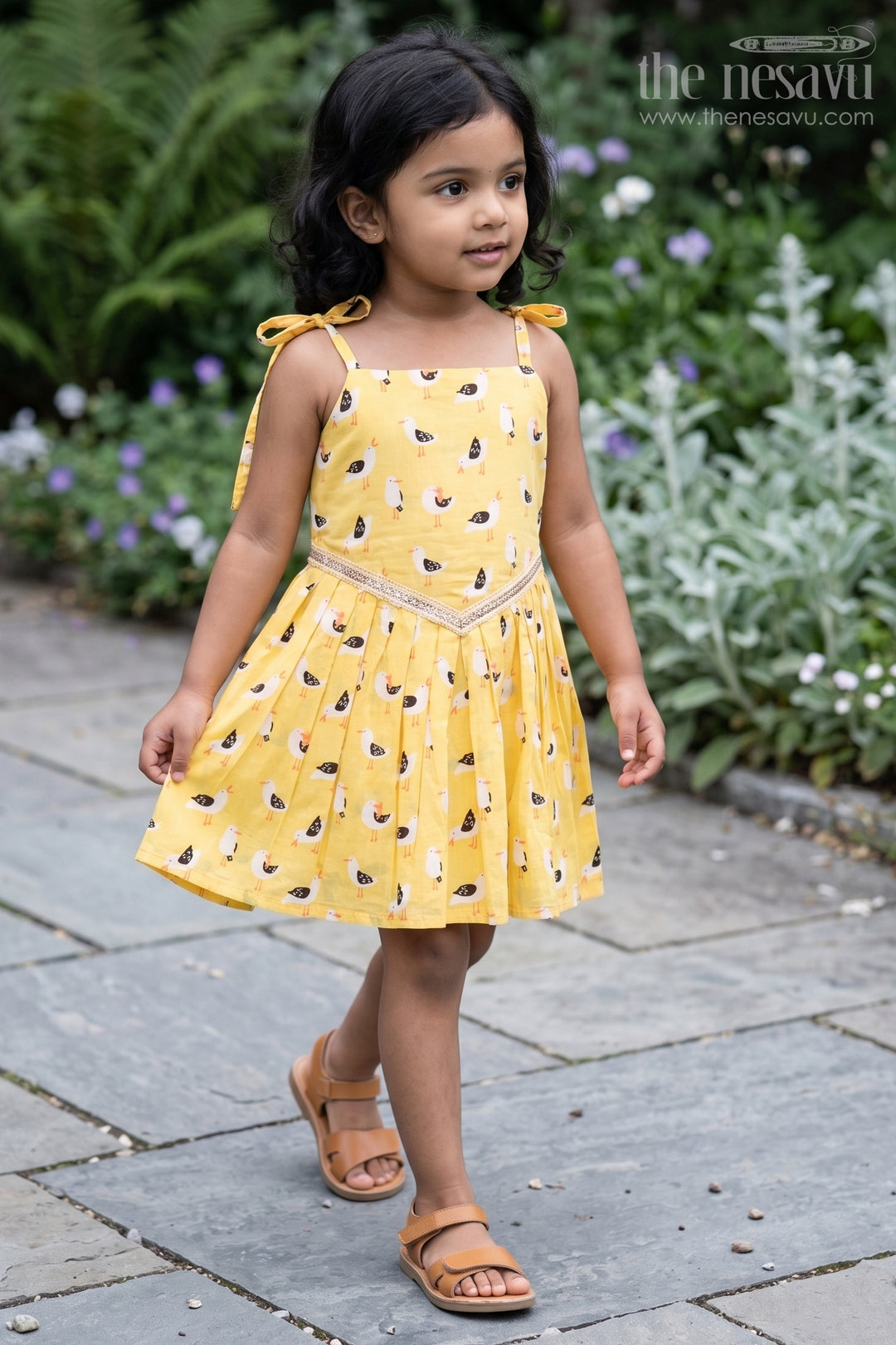 The Nesavu Tie-up Frock Yellow Tie-Up Cotton Frock for Toddler Girls with Playful Bird Print Nesavu 18 (2Y) / Yellow T414B-18 Nesavu yellow cotton tie-up frock for toddler girls with playful bird print and pleated flare