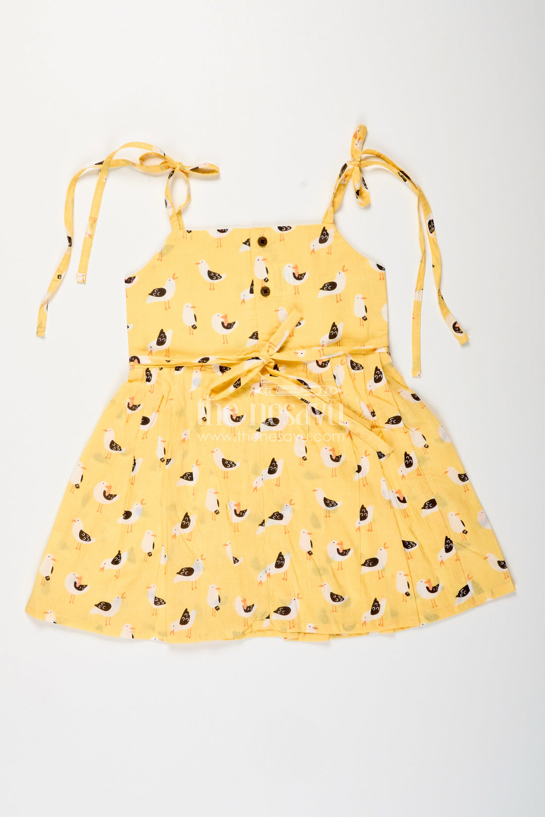 The Nesavu Tie-up Frock Yellow Tie-Up Cotton Frock for Toddler Girls with Playful Bird Print Nesavu Nesavu yellow cotton tie-up frock for toddler girls with playful bird print and pleated flare