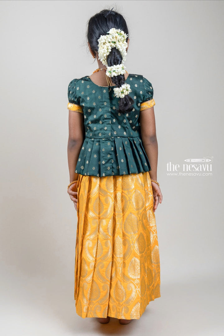 The Nesavu Pattu Pavadai Zari Butta Printed Green Silk Peplum Blouse with Knife Pleated Yellow Pattu Pavadai for Girls Nesavu Zari Butta Printed Green Silk Peplum Blouse with Knife Pleated yellow Pattu Pavadai for Girls | Shop at The Nesavu