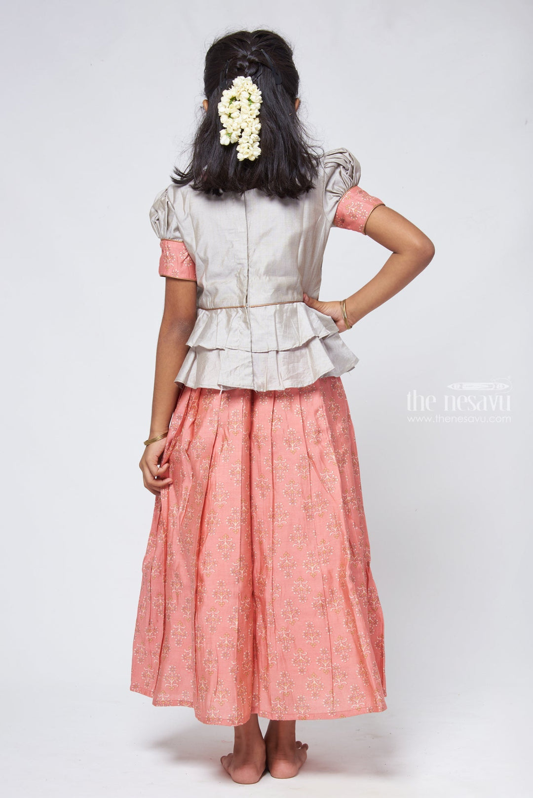 The Nesavu Pattu Pavadai Zari with Floral Printed Orange Pleated Skirt and Grey Jacquard Peplum Blouse Nesavu Latest Style Pattu Pavadai Design | Silk Readymade Dresses for Girls | The Nesavu